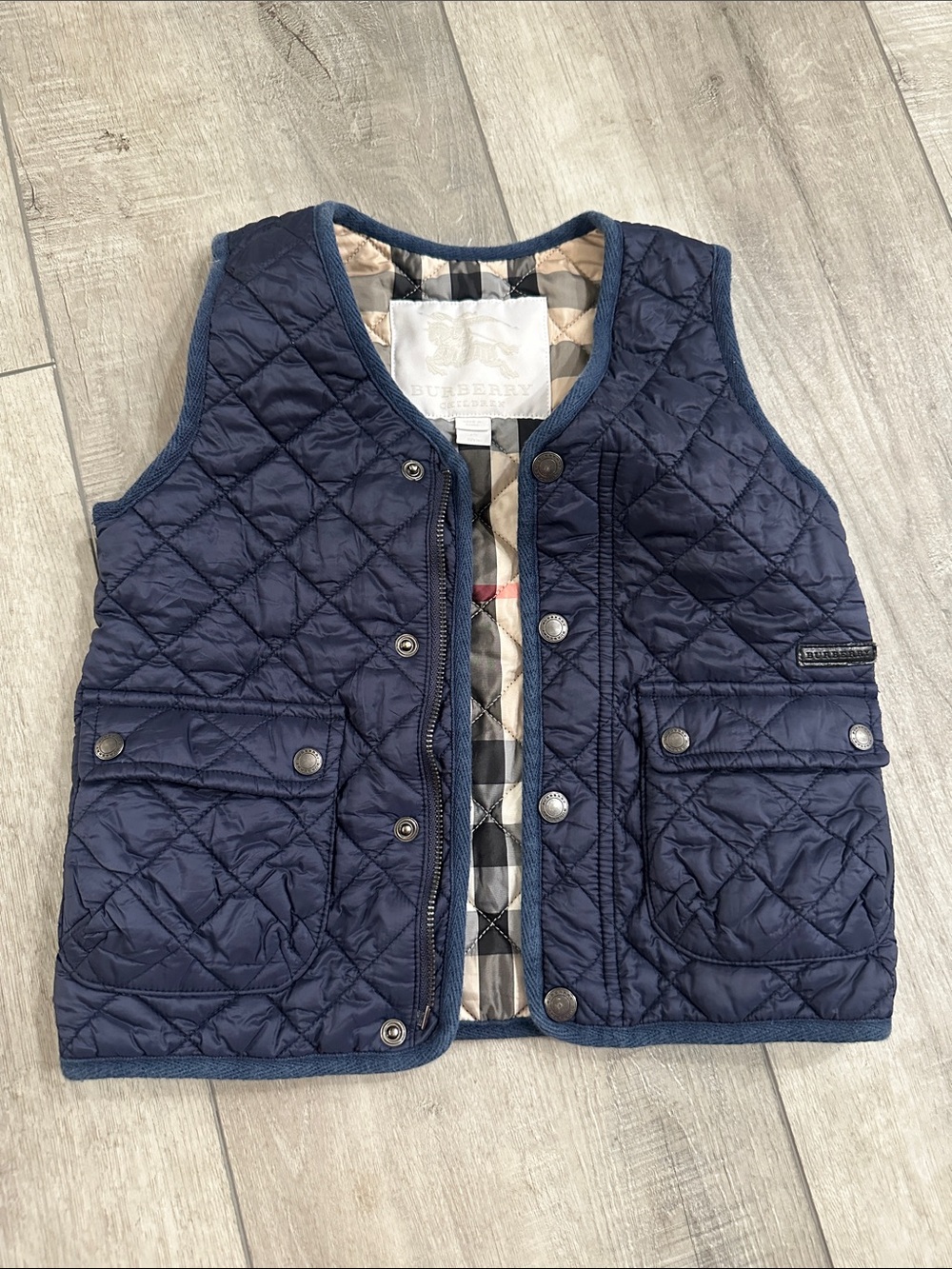 Burberry Kids navy quilted vest with signature check lining